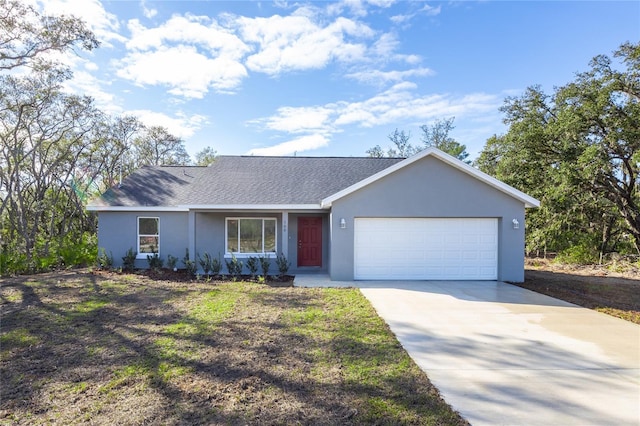 single story home with a shingled roof, concrete driveway, an attached garage, and stucco siding