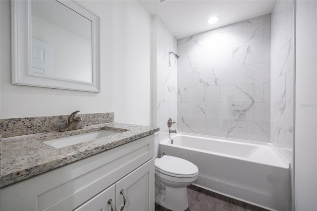 full bathroom with tub / shower combination, vanity, toilet, and wood finished floors