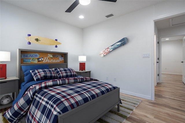 bedroom with recessed lighting, visible vents, a ceiling fan, wood finished floors, and baseboards