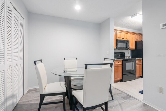 dining space featuring baseboards