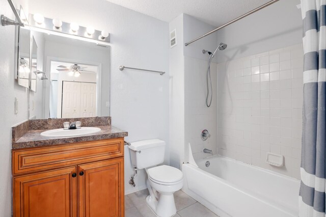 full bathroom with visible vents, shower / tub combo with curtain, toilet, tile patterned floors, and vanity