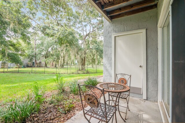 view of patio featuring fence