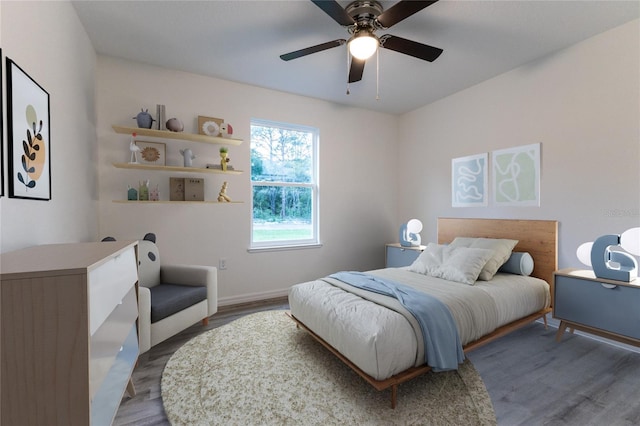 bedroom with ceiling fan and hardwood / wood-style floors