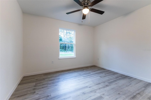 unfurnished room featuring ceiling fan and light wood-type flooring