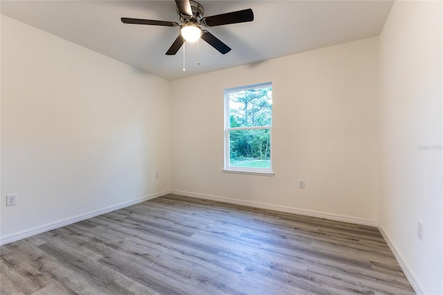 spare room featuring ceiling fan and light wood-type flooring