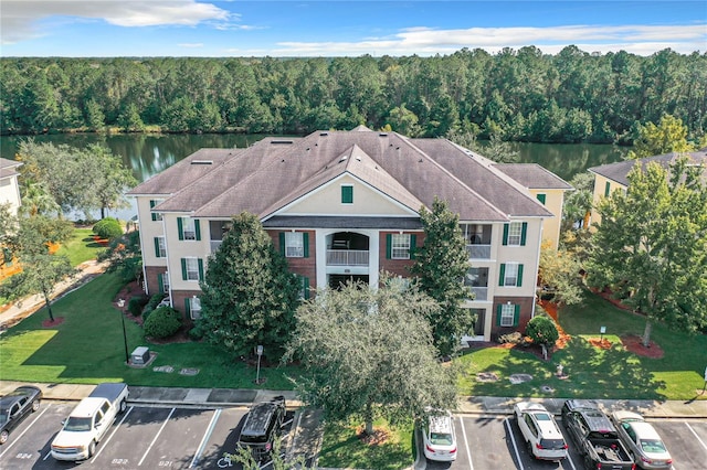 birds eye view of property with a water view