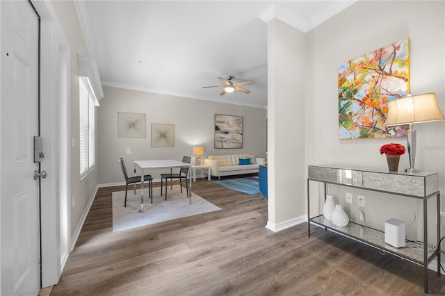 interior space featuring ornamental molding, hardwood / wood-style flooring, and ceiling fan