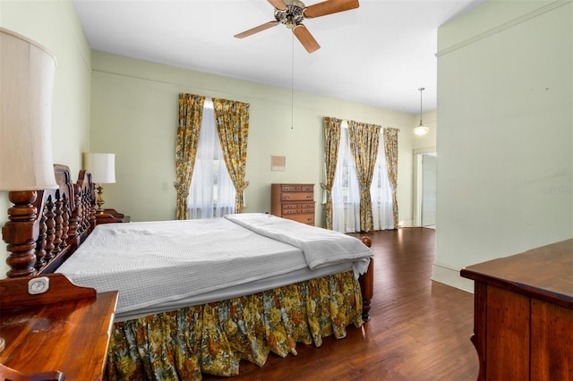 bedroom featuring dark hardwood / wood-style floors and ceiling fan