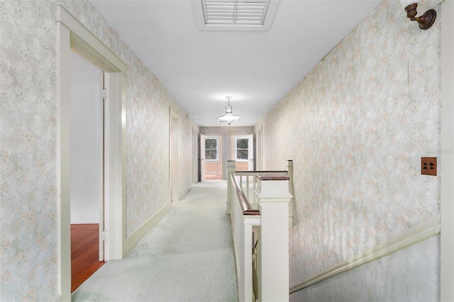 hallway with light carpet