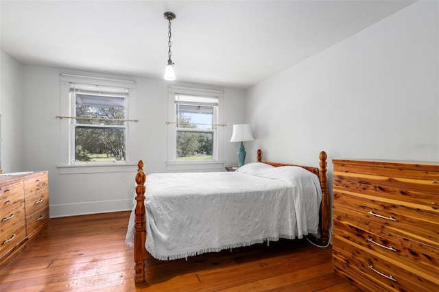 bedroom featuring dark hardwood / wood-style flooring