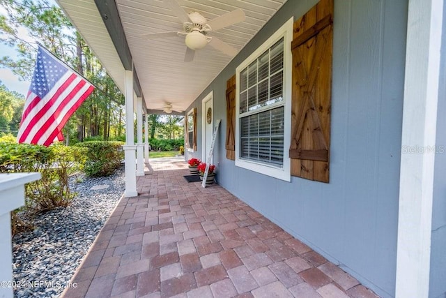 view of patio / terrace with ceiling fan and a porch