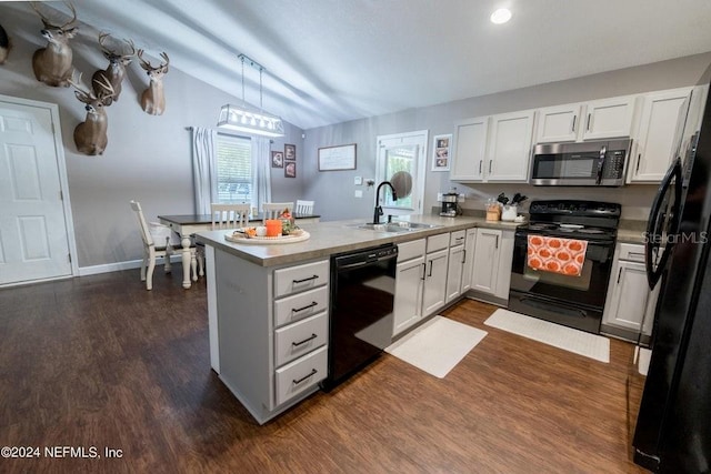 kitchen with white cabinets, lofted ceiling, sink, decorative light fixtures, and black appliances