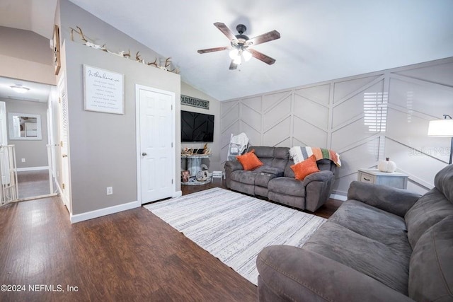 unfurnished living room with dark hardwood / wood-style floors, vaulted ceiling, and ceiling fan