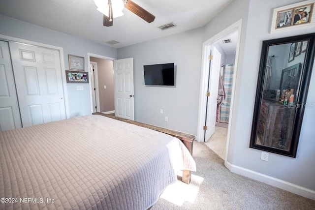 carpeted bedroom featuring ceiling fan and a closet