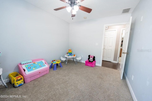 rec room with carpet floors and ceiling fan