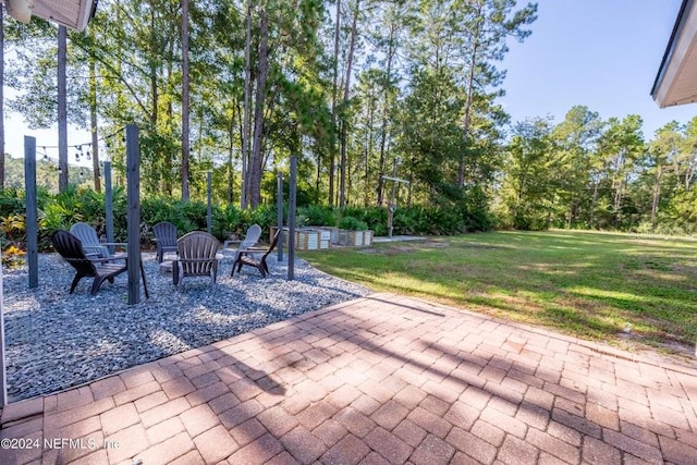 view of patio with a fire pit