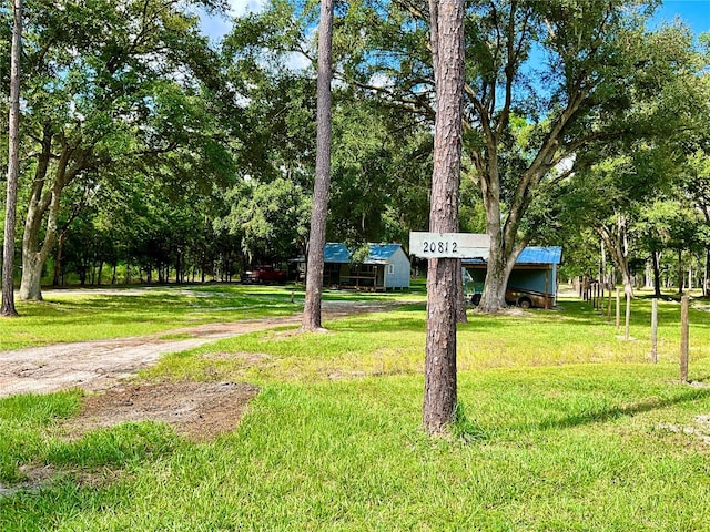 view of property's community with a lawn