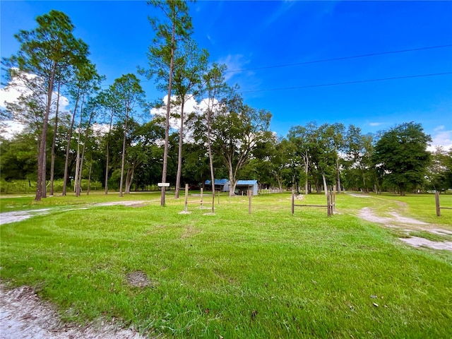 view of home's community featuring a lawn