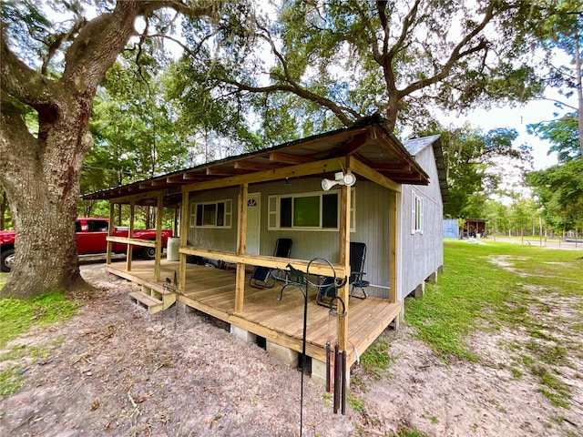 exterior space with a yard and a wooden deck