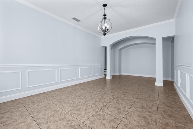 unfurnished room featuring tile patterned floors, crown molding, a notable chandelier, and a textured ceiling