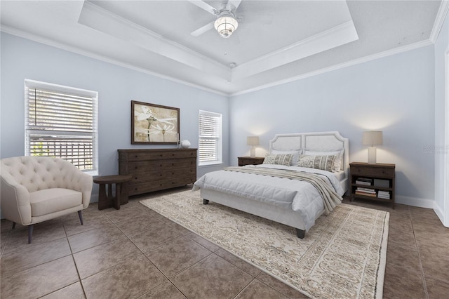 bedroom with multiple windows, ornamental molding, a raised ceiling, and ceiling fan