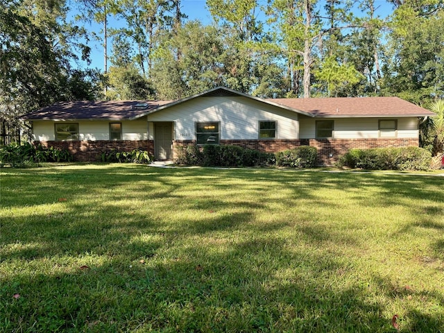 single story home featuring a front yard