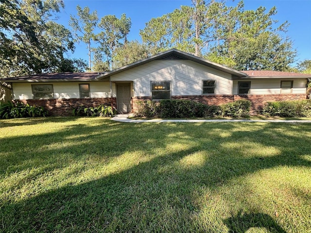 single story home with a front yard