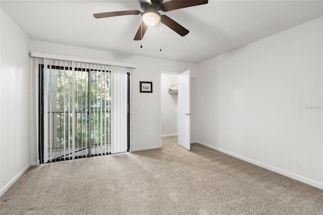 empty room featuring light carpet and ceiling fan