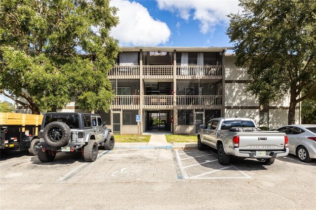 6519 W Newberry Rd Unit 805, Gainesville, FL 32605 - view of building exterior with uncovered parking