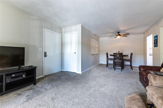 carpeted living room featuring ceiling fan