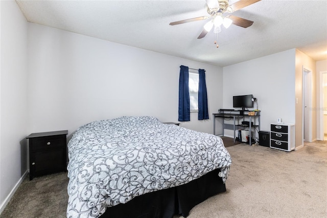 bedroom with ceiling fan, a textured ceiling, and carpet flooring