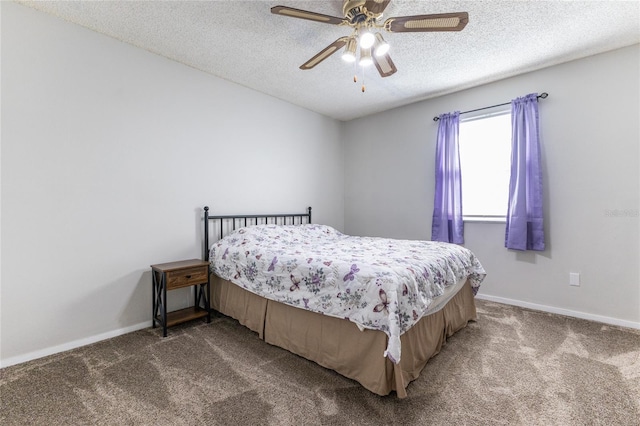 bedroom featuring carpet flooring, a textured ceiling, and ceiling fan