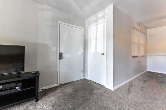 foyer with carpet flooring