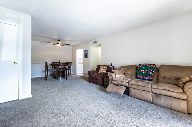 6519 W Newberry Rd Unit 805, Gainesville, FL 32605 - living room with visible vents, baseboards, carpet flooring, and ceiling fan