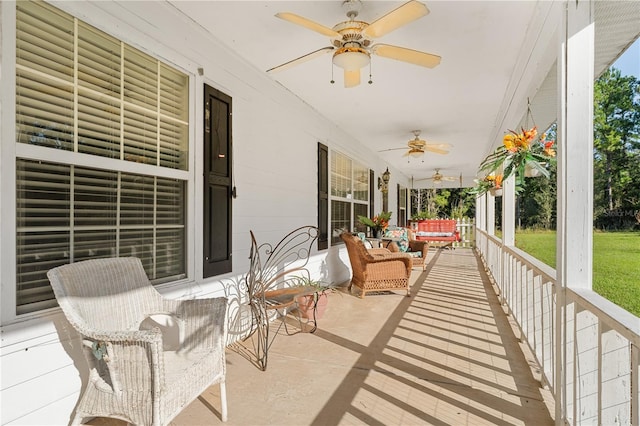 view of patio with a porch, an outdoor living space, and ceiling fan