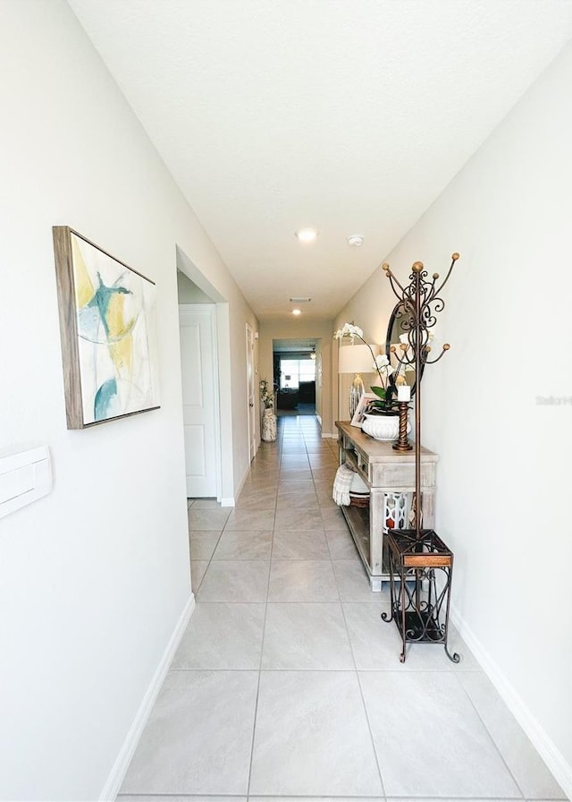 corridor featuring light tile patterned floors