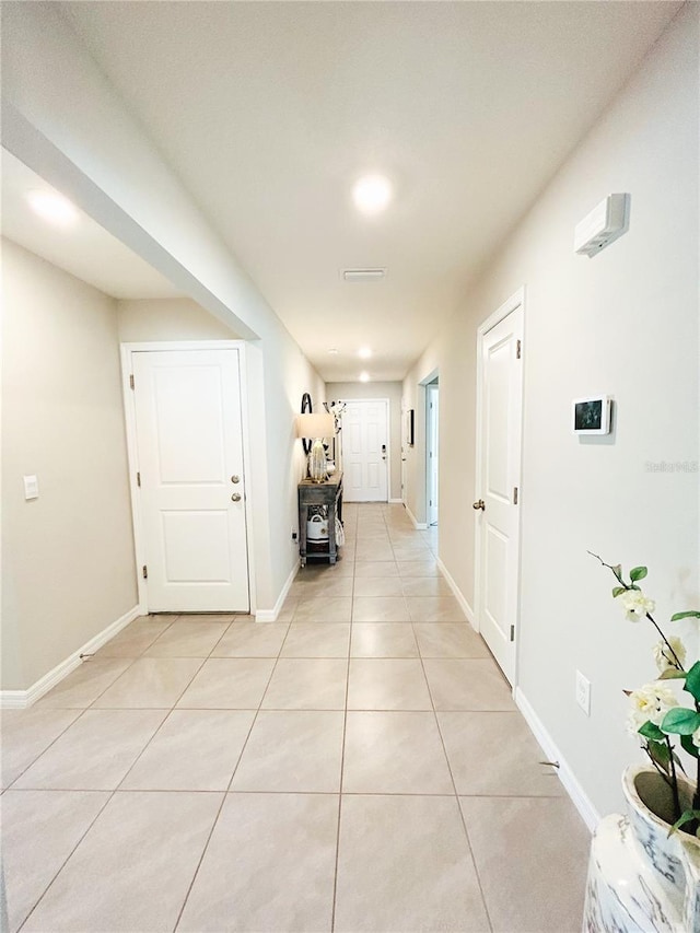 hallway featuring light tile patterned floors