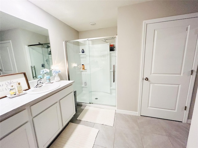 bathroom featuring an enclosed shower, tile patterned floors, and vanity