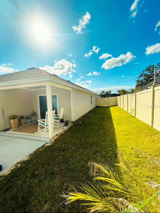 exterior space featuring a patio and a lawn