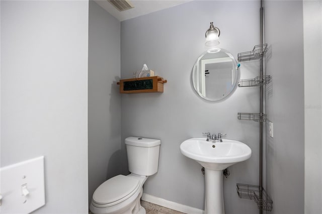 bathroom with toilet and sink