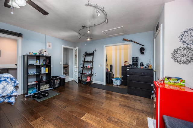 interior space featuring ceiling fan and dark hardwood / wood-style flooring