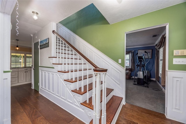 stairway with hardwood / wood-style floors