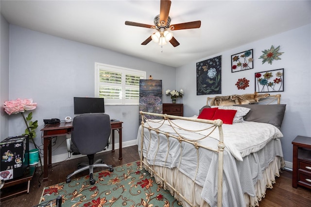 bedroom with dark hardwood / wood-style floors and ceiling fan