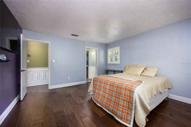 bedroom featuring dark wood-type flooring