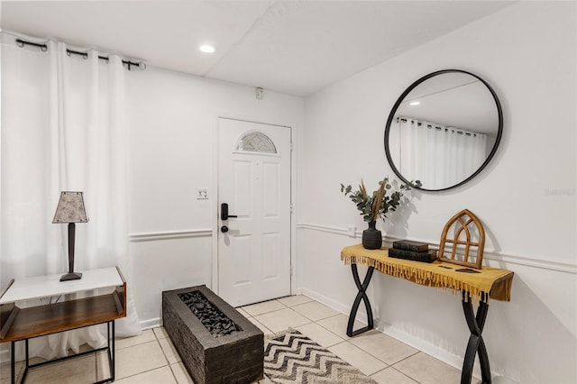 entryway with light tile patterned floors