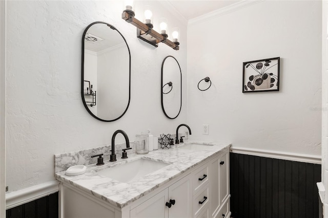 bathroom with ornamental molding and vanity