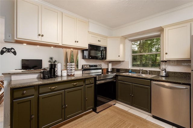 kitchen featuring sink, light tile patterned floors, appliances with stainless steel finishes, dark stone countertops, and ornamental molding