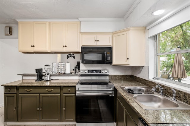 kitchen featuring cream cabinets, sink, electric range, and dark brown cabinetry