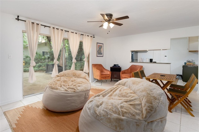 tiled living room featuring ceiling fan