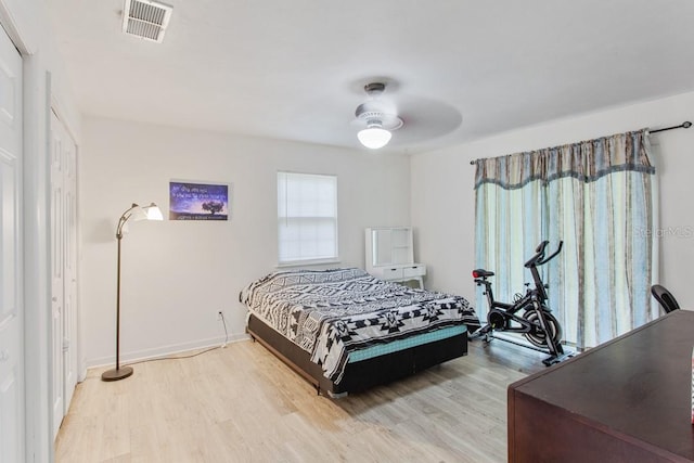 bedroom featuring light wood-type flooring and ceiling fan